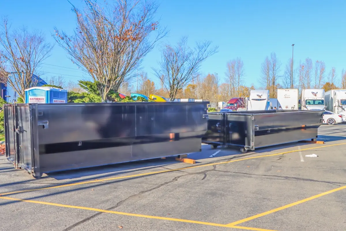 Professional dumpster rental service with roll-off container on residential driveway in Citrus Springs